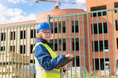 Portrait of senior man at construction site