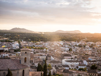 High angle view of town against cloudy sky