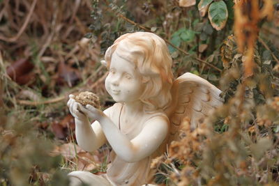 Close-up of statue against plants