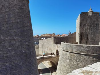 Low angle view of old ruins against clear sky