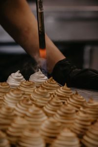 Midsection of woman and desserts 