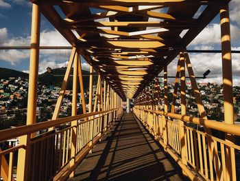 Bridge over footbridge against sky