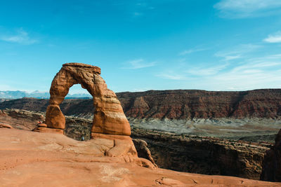 Rock formations on landscape against sky