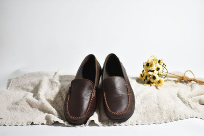 Close-up of shoes against white background