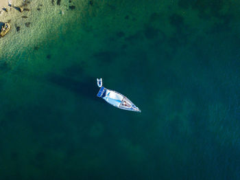 High angle view of sailboat swimming in sea