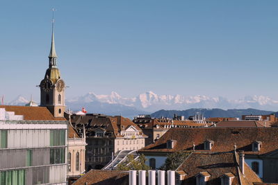 View of buildings in city against sky