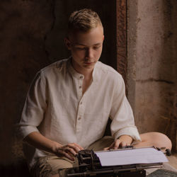 Young man using laptop at home