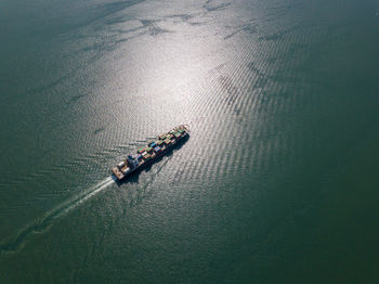 High angle view of people on boat in sea