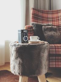 Close-up of coffee cup on table at home