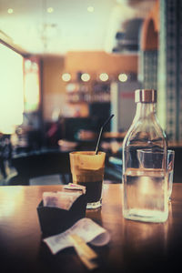 Close-up of wine glass on table at cafe