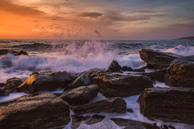 Scenic view of sea against sky during sunset