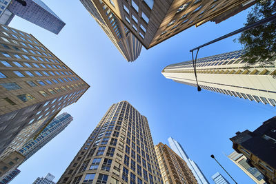 Low angle view of skyscrapers against sky