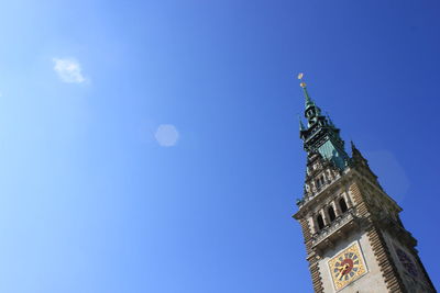 Low angle view of hamburg rathaus against clear blue sky