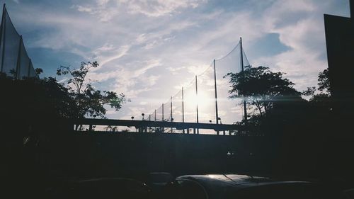 Cars on road at sunset