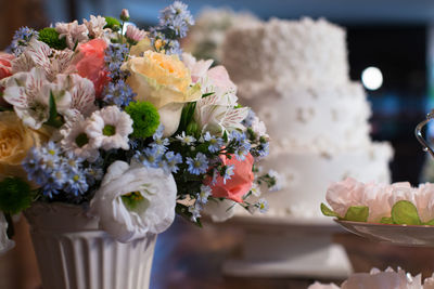 Close-up of white roses on table