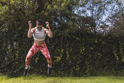 Woman training and stretching outdoors