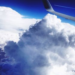 Low angle view of clouds over landscape