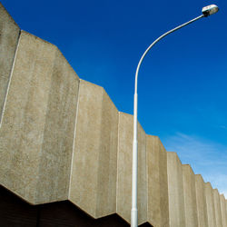 Low angle view of street light against clear blue sky