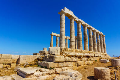 Old ruins of temple against blue sky