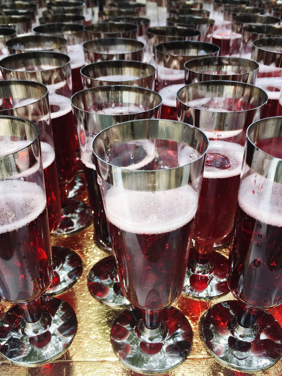 CLOSE-UP OF WINE GLASSES ON TABLE AT KITCHEN