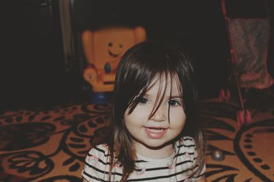 Portrait of baby girl smiling at home