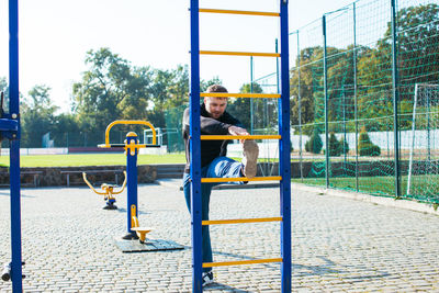 Man sitting in playground