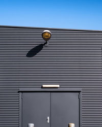 Low angle view of illuminated light against building