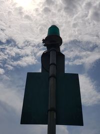 Low angle view of communications tower against sky