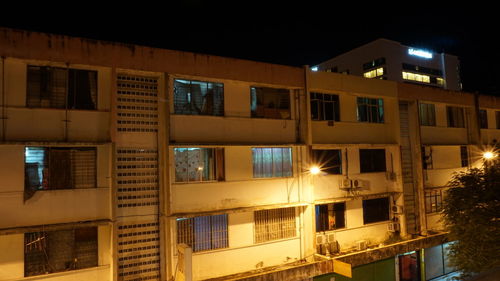 Low angle view of illuminated building at night