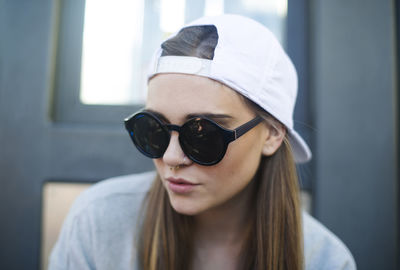 Portrait of young woman wearing sunglasses