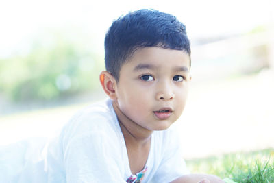 Portrait of cute boy on field