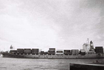 Boats in sea against sky