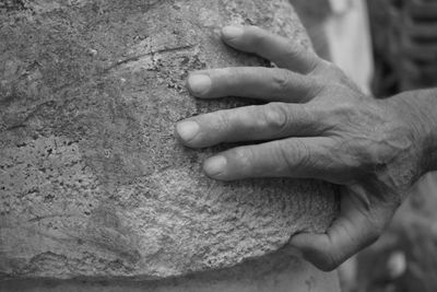 Close-up of hand holding hands