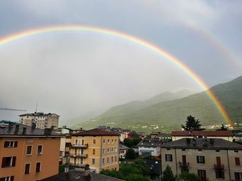 Scenic view of rainbow over town