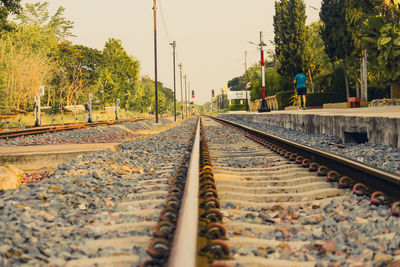 Surface level of railroad tracks against clear sky