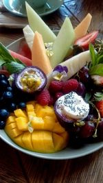 Close-up of served fruits in plate