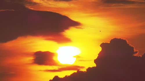 Low angle view of cloudy sky at sunset