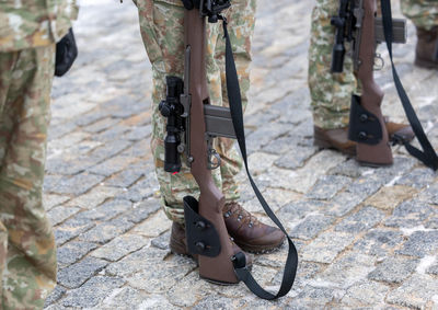 Low section of soldiers standing on street