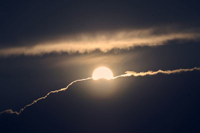 Low angle view of silhouette moon against sky during sunset