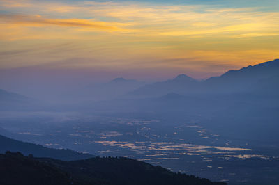 Scenic view of mountains against sky during sunset