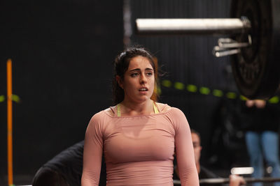 Portrait of young woman looking away