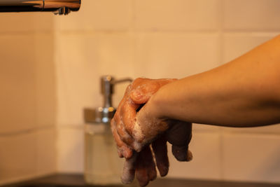 Midsection of man in bathroom at home