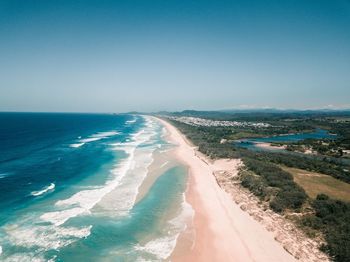 Aerial view of sea against clear sky