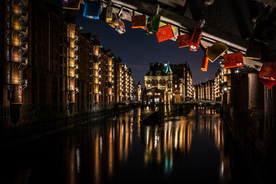 Illuminated buildings in city at night