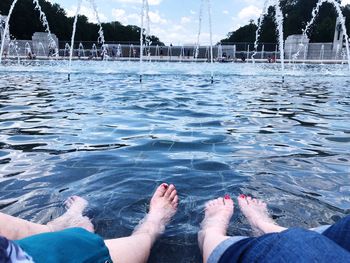 Low section of women in swimming pool