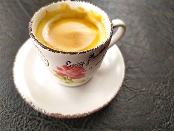 High angle view of coffee cup on table