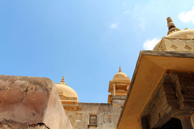 Low angle view of building against blue sky