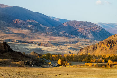 Scenic view of landscape and mountains against sky