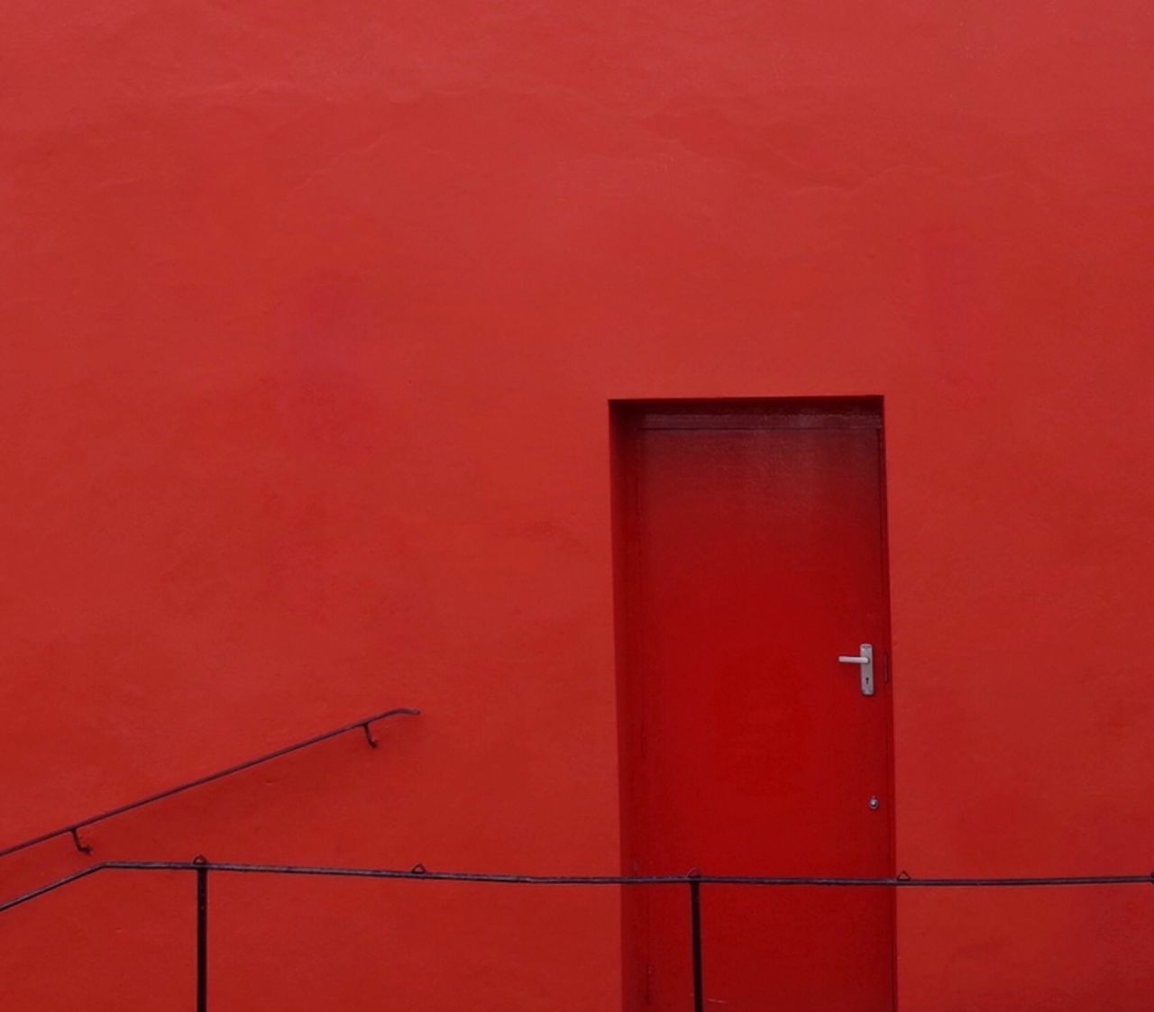 red, wall - building feature, built structure, architecture, copy space, wall, no people, safety, close-up, full frame, backgrounds, protection, metal, orange color, low angle view, day, building exterior, outdoors, security, closed