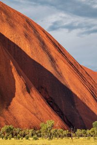 Scenic view of uluru against sky